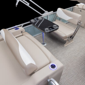 The image shows the interior of an LSZ Entertainer boat featuring beige and white cushioned seats, a rectangular table with cup holders, light carpet flooring, and blue LED accent lighting around the seating area.
