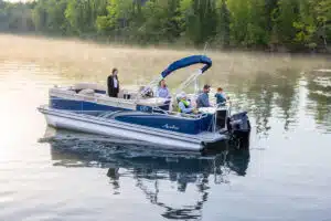 Family riding on a blue fishing pontoon boat