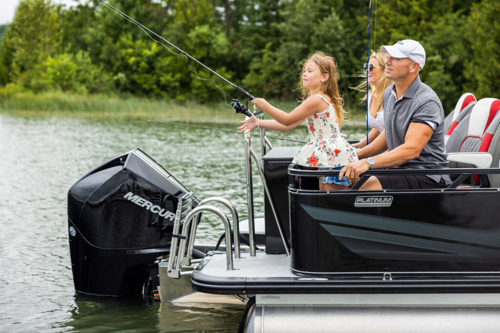 Family fishing off the back of an Avalon Venture 85