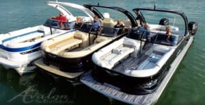 Three pontoon boats tied together.