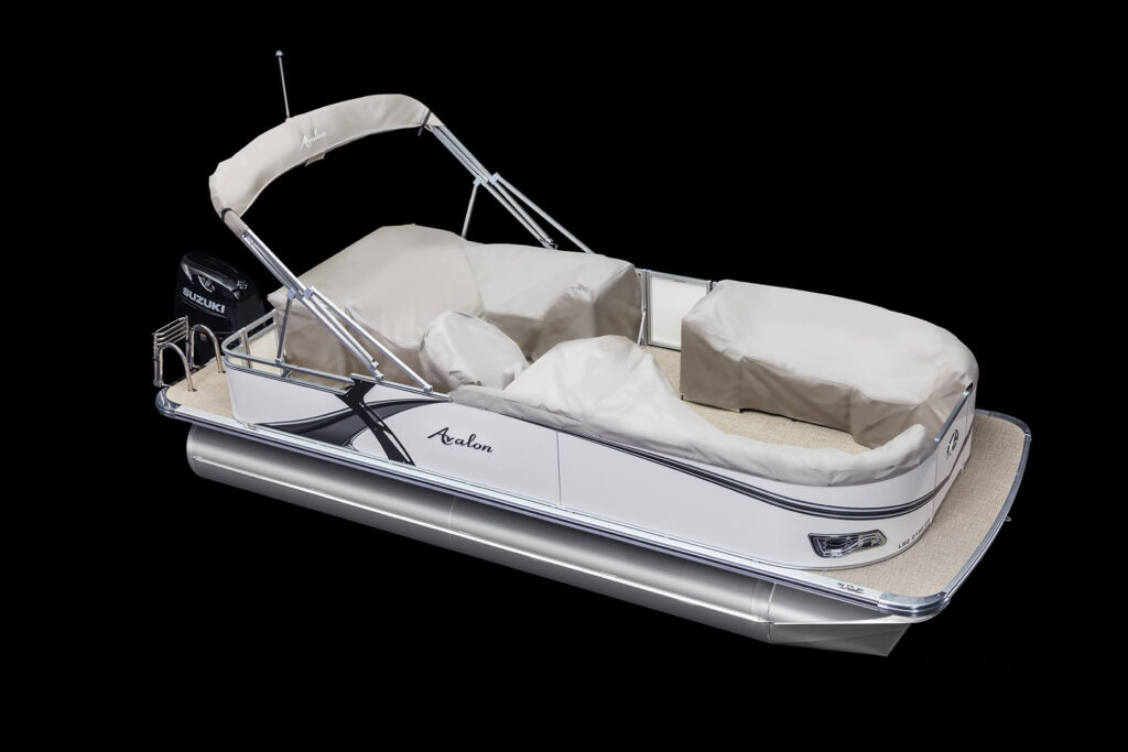 A white and silver Avalon pontoon boat with sturdy railing, covered seats, and a canopy. The boat is equipped with a Suzuki outboard motor and features black accents. It rests on silver pontoons and is displayed on a solid black background.