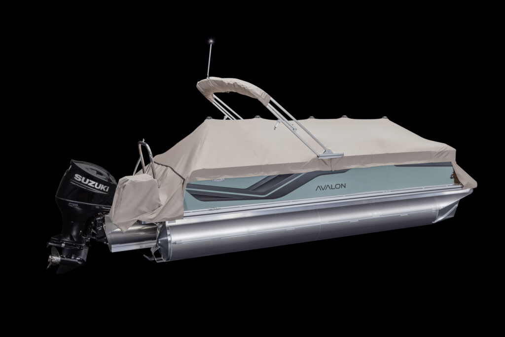 A silver Avalon pontoon boat with a beige cover and a Suzuki outboard motor, shown on a black background.