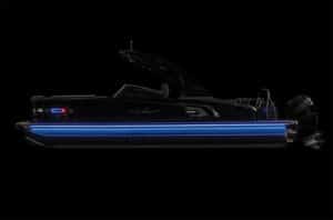 A sleek, black boat with a blue LED light strip along its side is shown against a black background. The boat has a modern design with an outboard motor at the rear and an illuminated interior, highlighting its luxury features.
