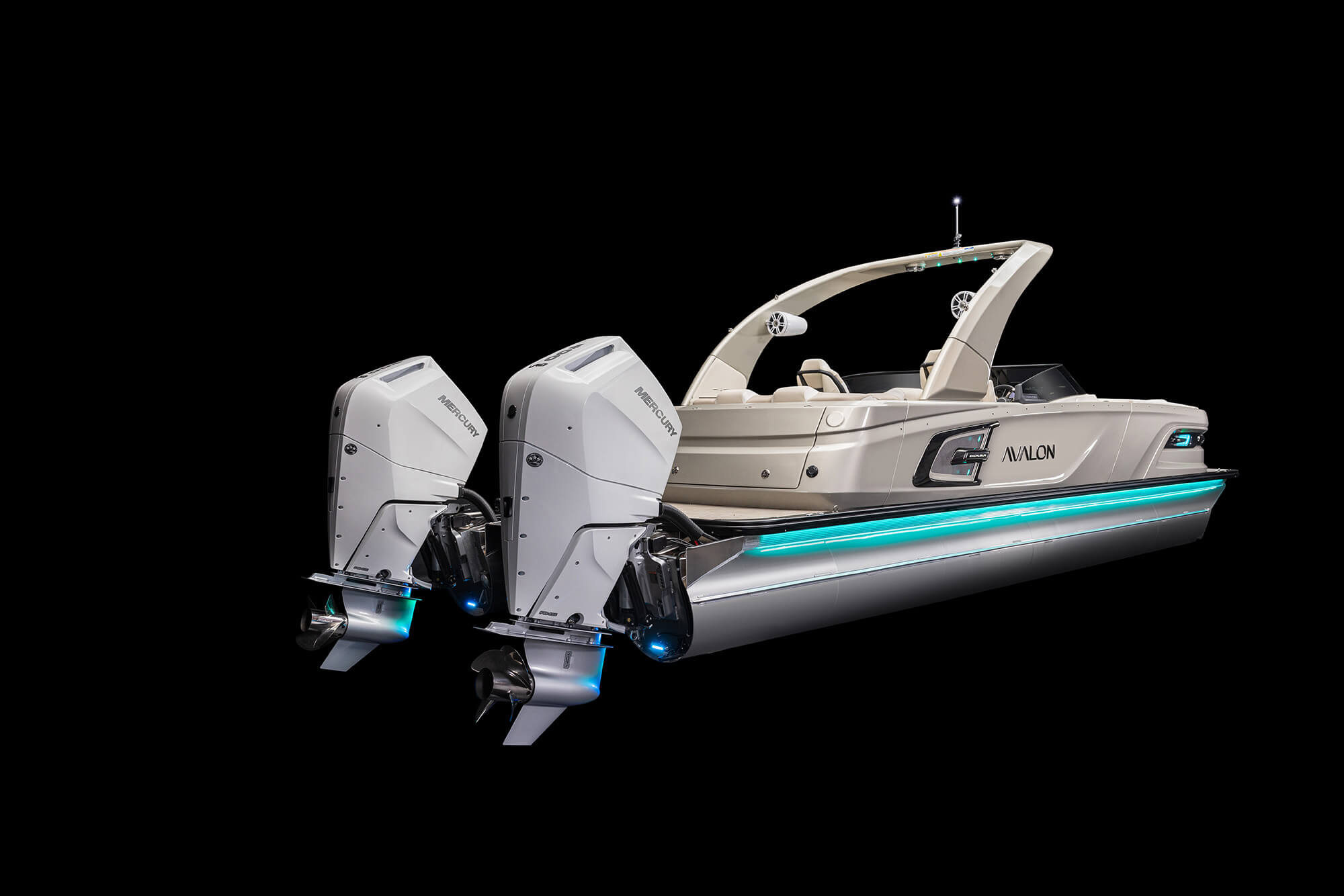 A luxury speedboat with dual outboard engines, sleek white design, and blue accent lights is shown against a black background. The boat features an elegant arch and a spacious deck area labeled "Avalon.