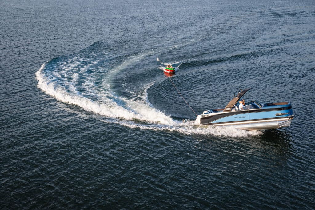 Tubing in a waketoon pontoon boat.