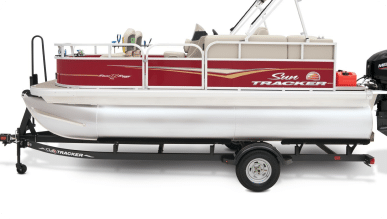 A Sun Tracker pontoon boat for sale with a red and beige color scheme is mounted on a black trailer. The boat features a beige seating area, railings, and a small ladder at the rear. The outboard motor is visible on the right side of the image.