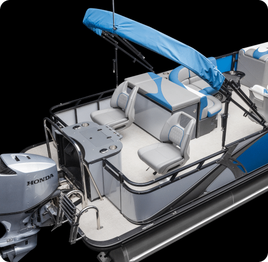 A pontoon boat featuring a blue and silver color scheme is available among our pontoons for sale. It includes a Honda outboard motor, padded seating with a small table, a retractable blue canopy, and additional seating across from the motor. The deck has a clean, minimalist design.