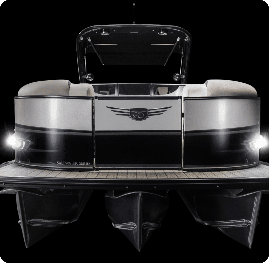 Front view of a sleek and modern pontoon boat from the Saltwater Series. The boat features a black and silver color scheme with a sophisticated design. Illuminated navigation lights are visible, and the deck is made of refined wood. Perfect for those looking at pontoons for sale!