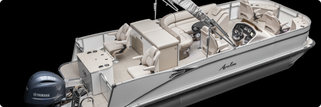 A luxury pontoon boat with beige seating and a Yamaha outboard motor features plush seats, cup holders, small pontoons for added stability, and various compartments. The steering console boasts multiple dials and controls, designed for comfort and recreational activities on the water.